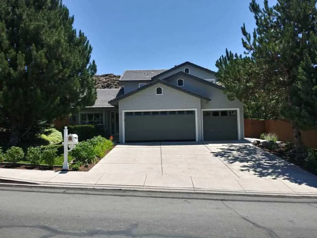 Grey two‑tone single‑storey home with fresh exterior paint